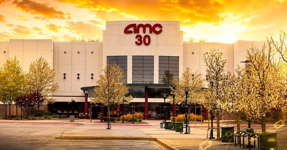 AMC movie theater exterior under a yellow-orange sky