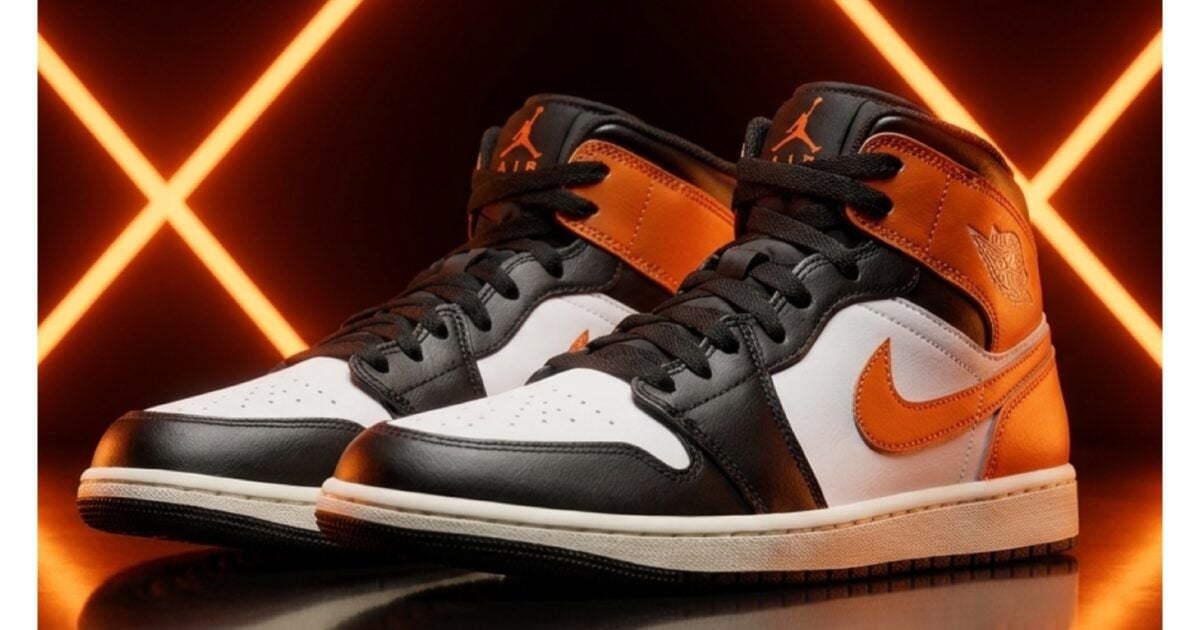Black, white, and orange Strategy Nike Air Jordan sneakers