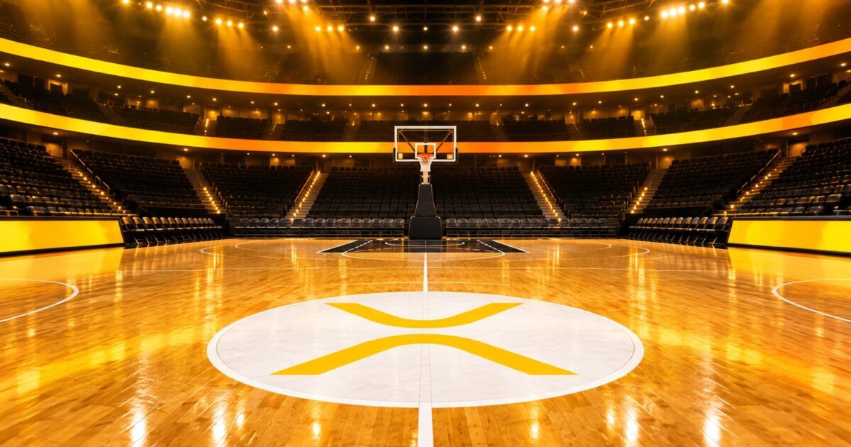 A premium college basketball arena with an XRP symbol at center court under yellow and orange lights