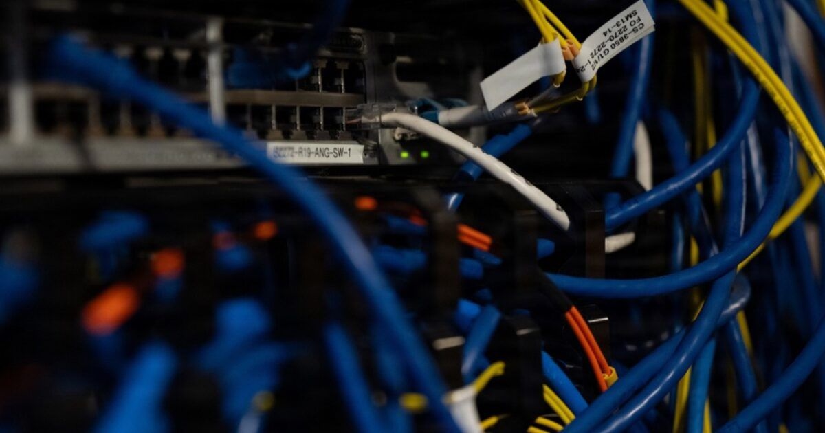 Close-up of network cables and server hardware during a cyber incident response