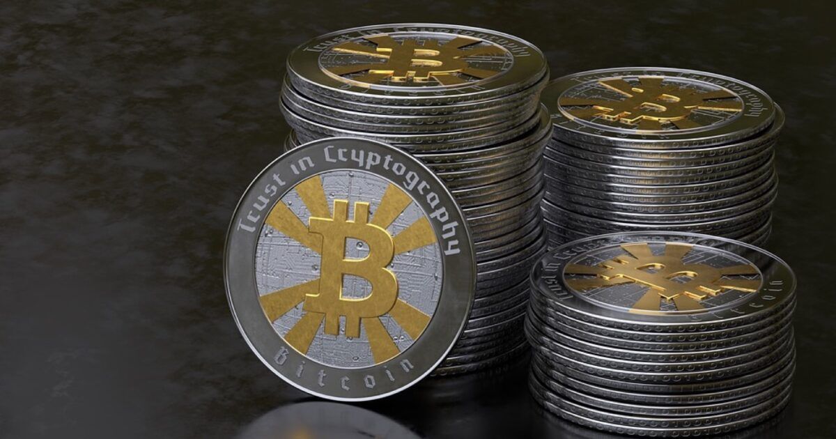 Stacks of physical Bitcoin tokens against a dark background