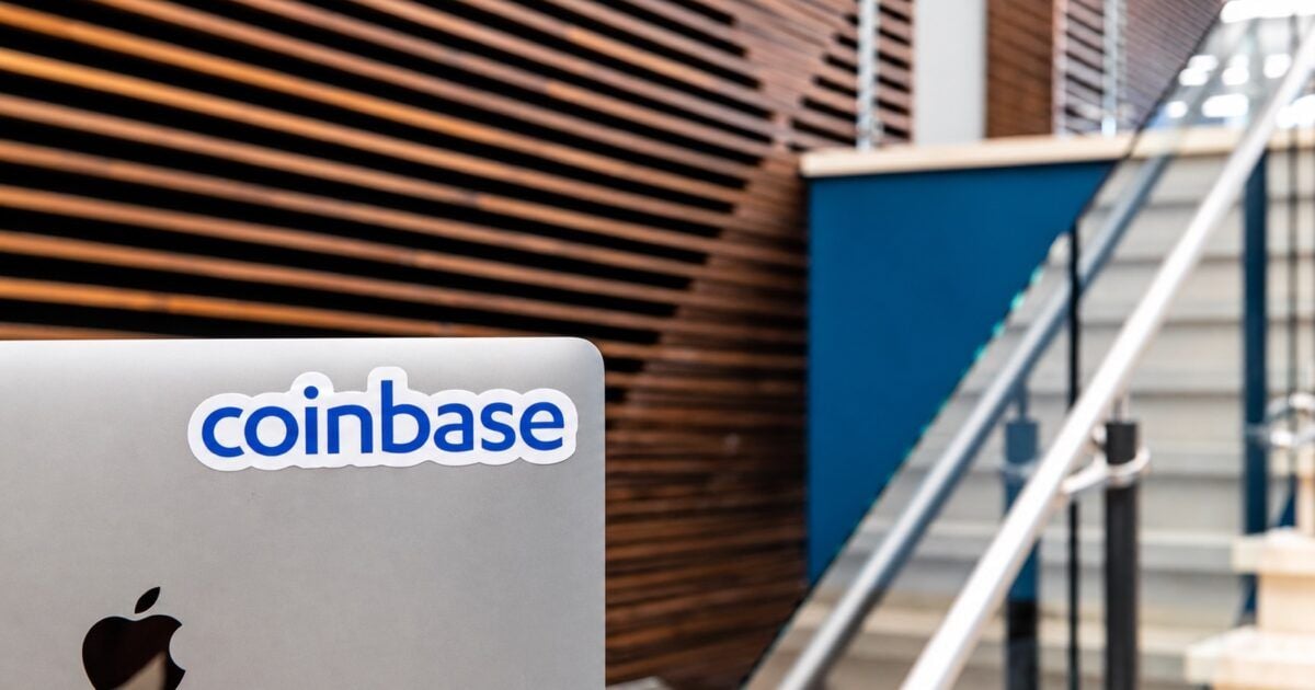 Coinbase-branded laptop in an official Coinbase workspace
